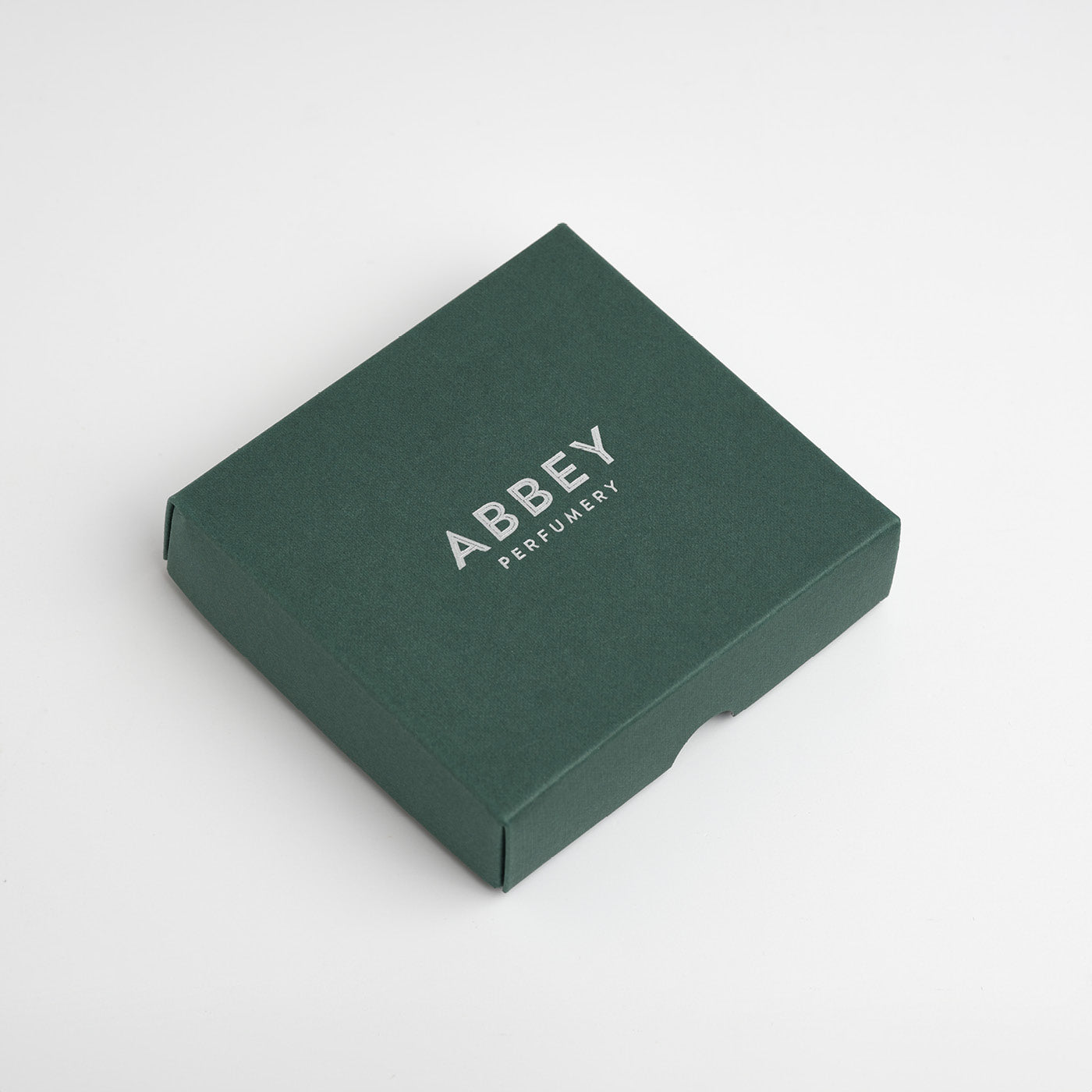 Luxury gift box with a silver foil logo in the centre