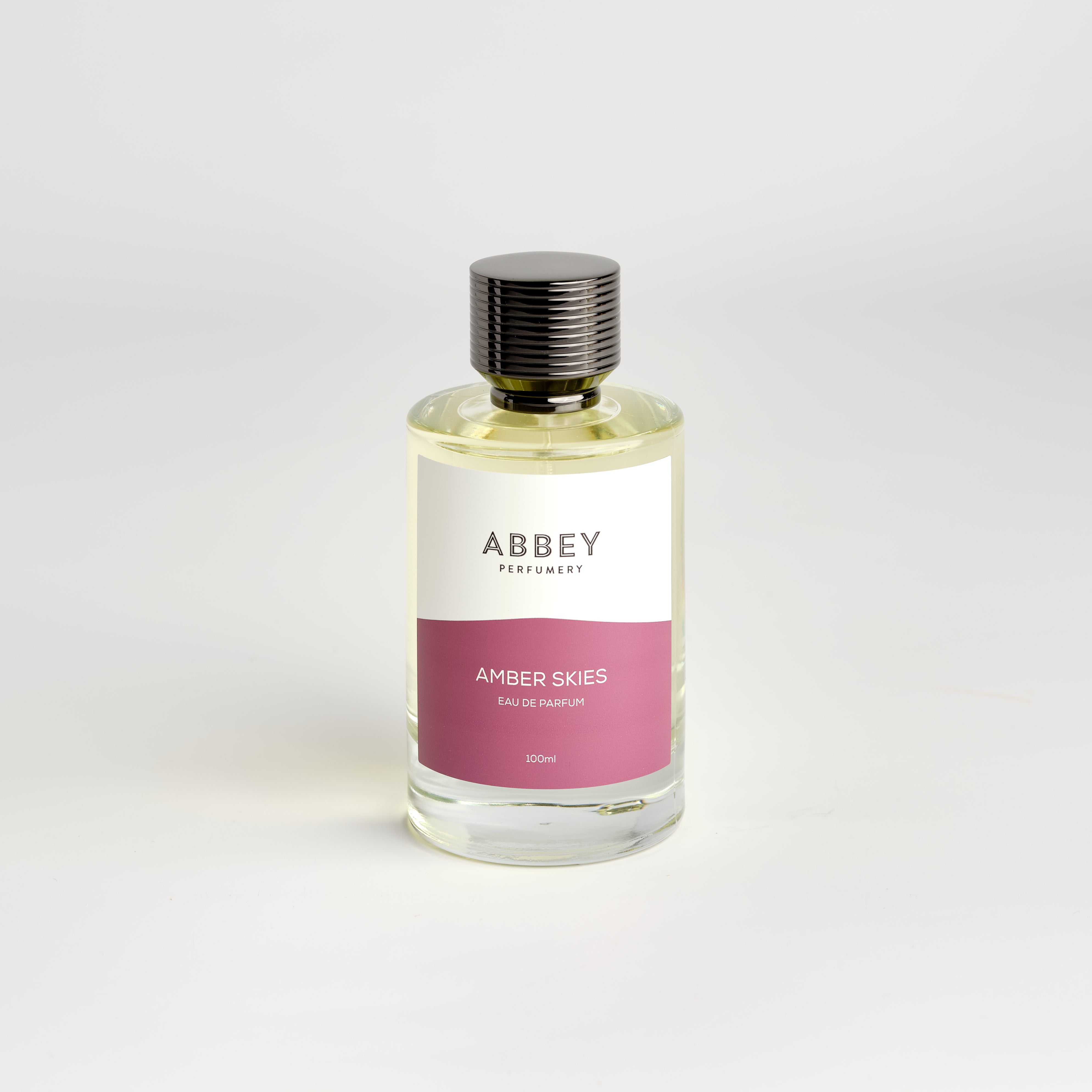Amber Skies perfume bottle 100ml on white background