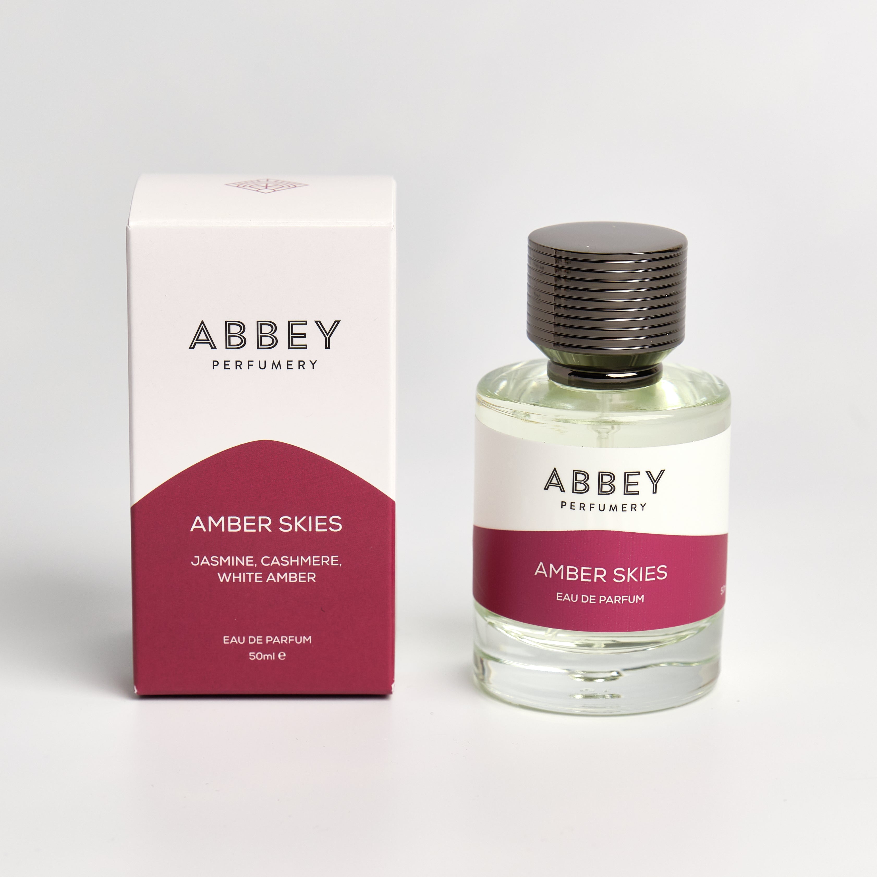 Amber Skies perfume bottle and box 50ml on white background