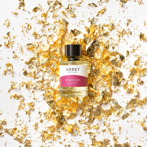 Amber Skies perfume bottle on gold flakes