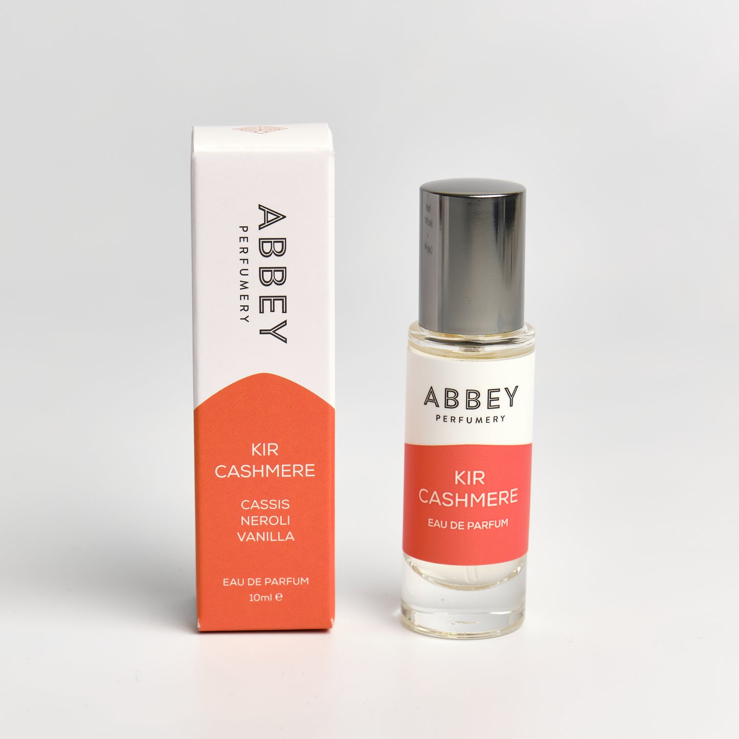 Kir Cashmere perfume bottle and box 10ml on white background